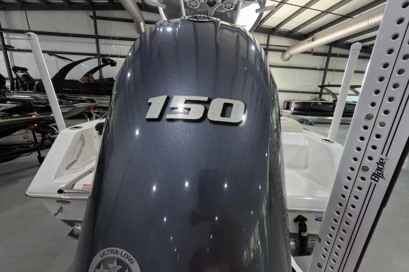 Slide: The Image of 2022 Tidewater boat with 150 horsepower engine in a showroom. - 15