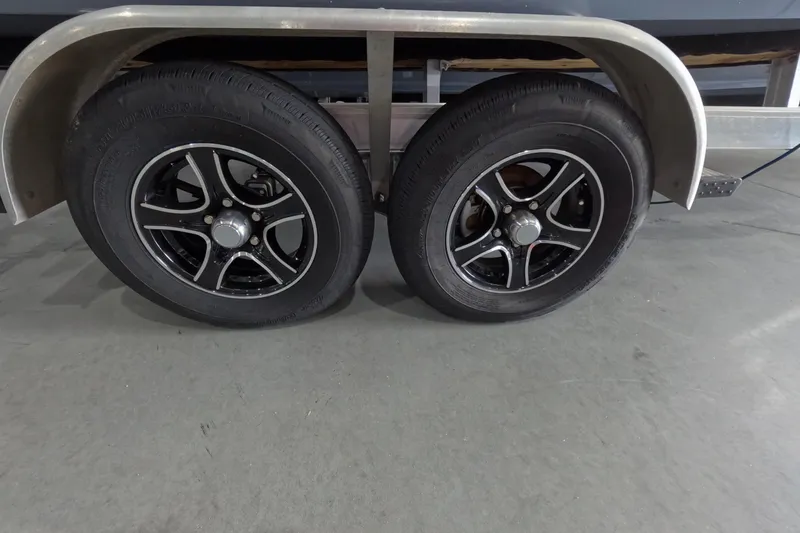 Slide: The Image of 2022 Tidewater trailer with dual black alloy wheels and silver fenders. - 16