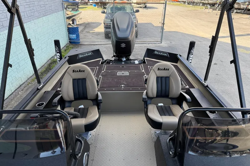 Slide: The Image of 2026 SeaArk Big Easy boat interior with dual seats and Suzuki engine. - 11