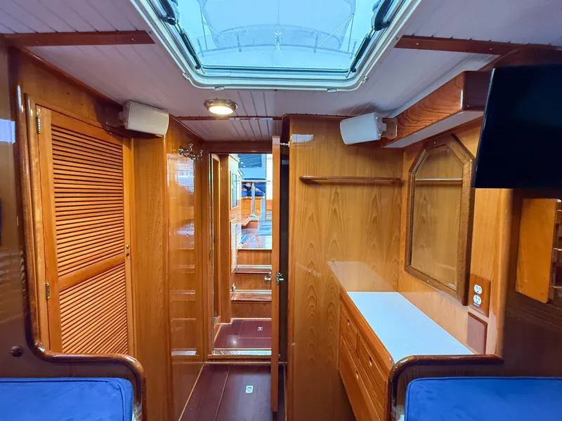 Slide: The Image of Interior of 1984 Wilbur 38 boat with wooden finish and skylight. - 38