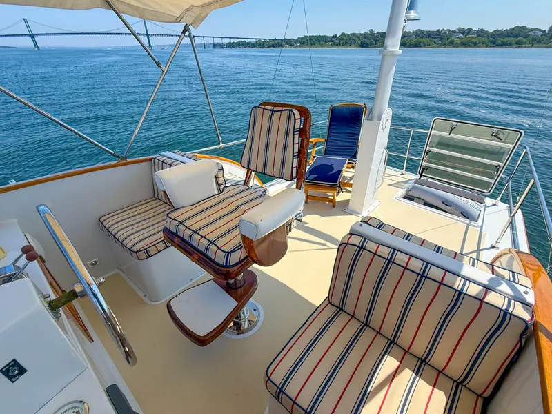 Slide: The Image of Luxury seating on 1984 Wilbur 38 yacht with scenic ocean view. - 8