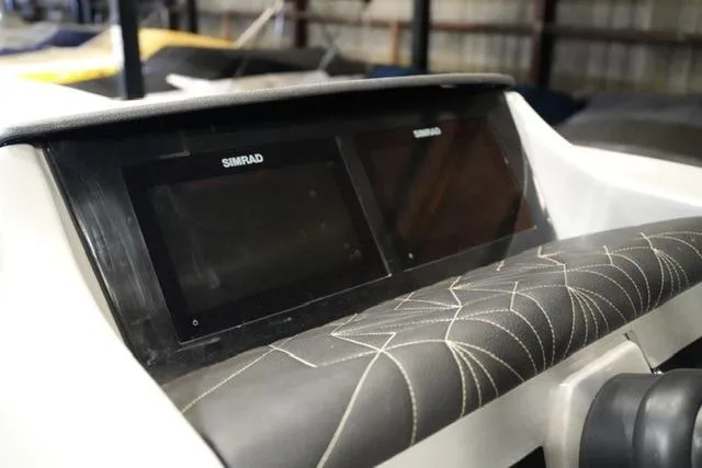 Slide: The Image of 2023 Harris Grand Mariner 250 SLDH dashboard with dual Simrad displays. - 6
