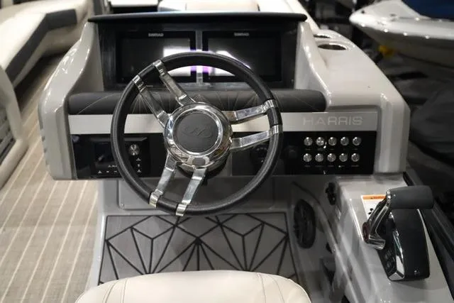 Slide: The Image of 2023 Harris Grand Mariner 250 SLDH boat dashboard with steering wheel and controls. - 7