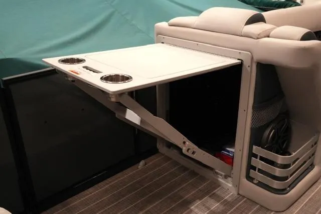 Slide: The Image of 2023 Harris Grand Mariner 250 SLDH interior with fold-out table and cup holders. - 8