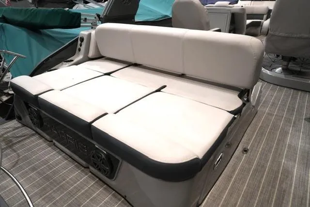Slide: The Image of 2023 Harris Grand Mariner 250 SLDH boat interior with cushioned seating and modern design. - 9