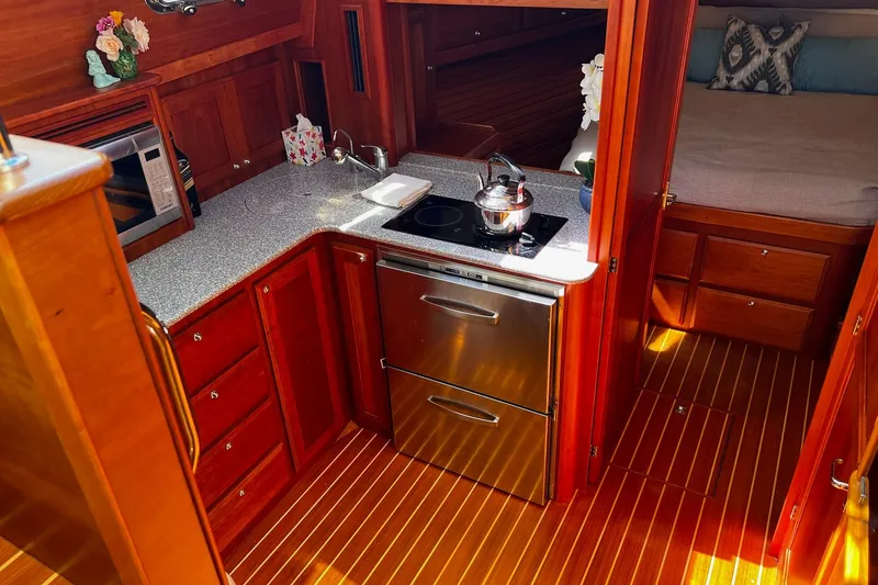 Slide: The Image of Luxurious 2016 Sabre 38 Salon Express yacht interior with modern kitchen and cozy cabin. - 15