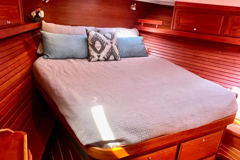 Slide: The Image of Cozy cabin bedroom in 2016 Sabre 38 Salon Express yacht with wooden interior. - 16