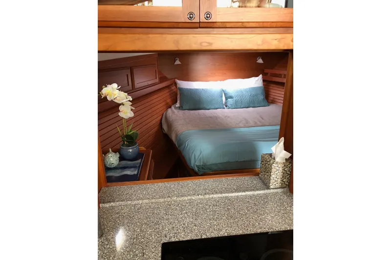 Slide: The Image of Cozy bedroom interior of 2016 Sabre 38 Salon Express yacht with elegant wood finish. - 18