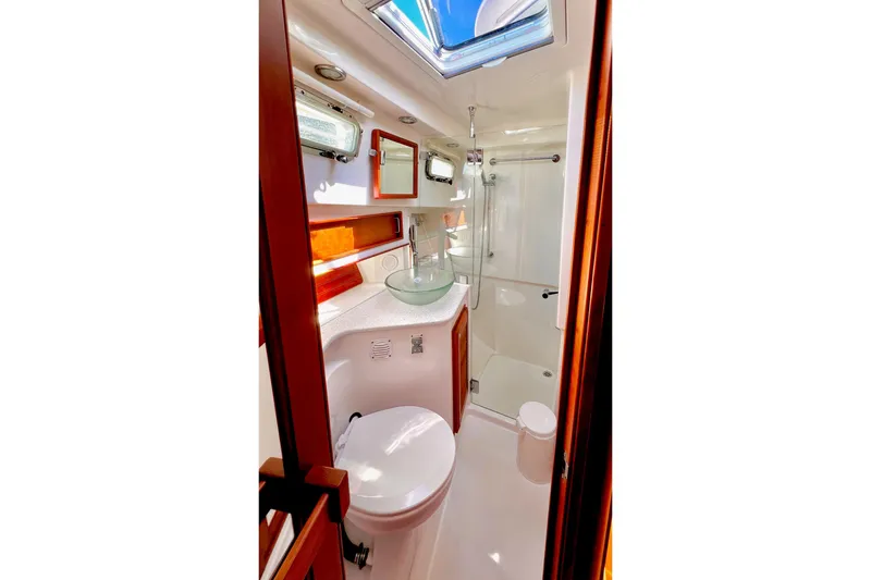 Slide: The Image of Luxurious bathroom in 2016 Sabre 38 Salon Express yacht with modern fixtures and skylight. - 21
