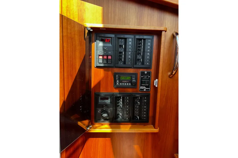 Slide: The Image of Electrical panel of 2016 Sabre 38 Salon Express yacht with wooden finish. - 23