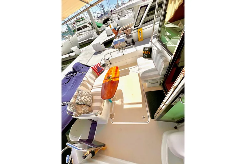 Slide: The Image of 2016 Sabre 38 Salon Express yacht interior with seating and table at marina. - 24