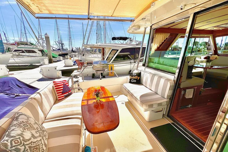 Slide: The Image of Luxurious 2016 Sabre 38 Salon Express yacht interior with striped seating and elegant decor. - 26