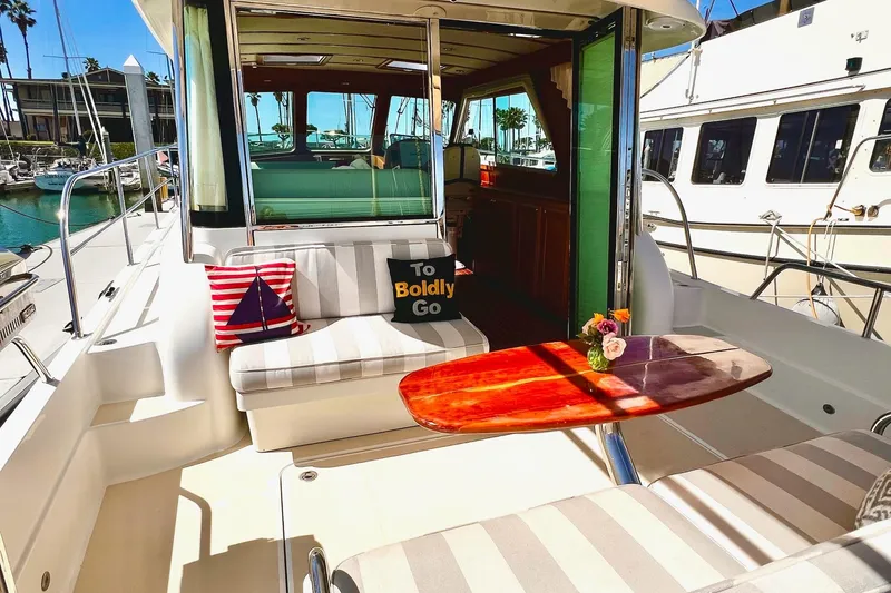 Slide: The Image of Luxurious 2016 Sabre 38 Salon Express yacht interior with stylish seating and decorative pillows. - 28