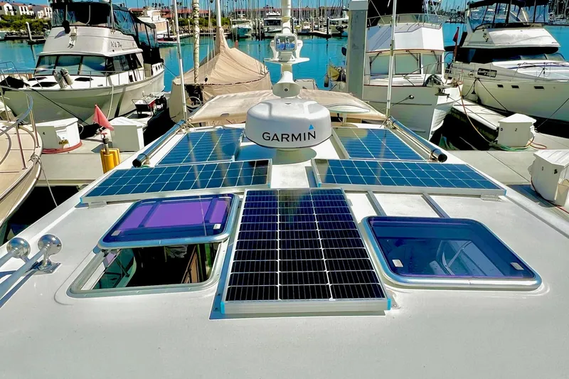 Slide: The Image of 2016 Sabre 38 Salon Express with solar panels and Garmin equipment at marina. - 35