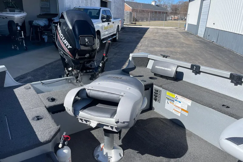 Slide: The Image of 2016 Alumacraft Escape 145 Tiller boat with Mercury engine and Humminbird electronics. - 2