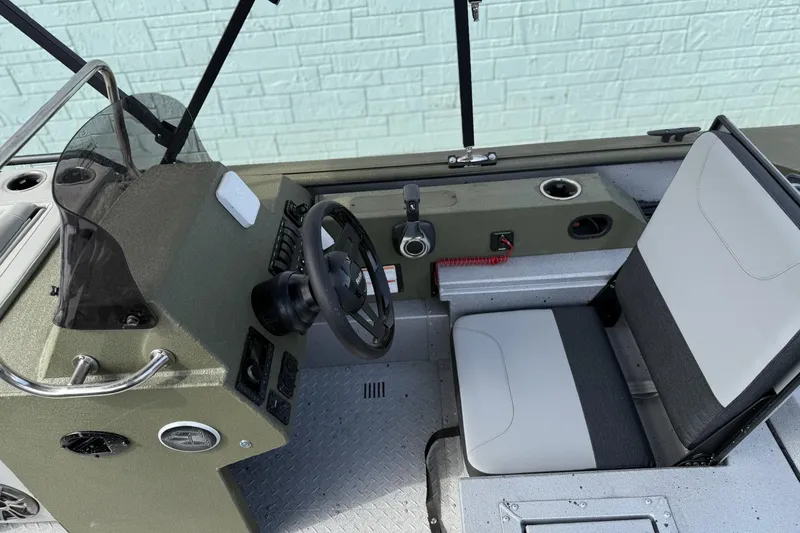 Slide: The Image of 2026 SeaArk Easy 200 boat interior with steering wheel and seating. - 10