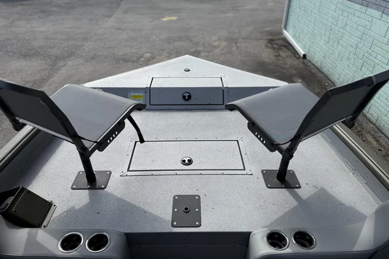 Slide: The Image of 2026 SeaArk Easy 200 boat deck with two fishing seats and storage compartments. - 12