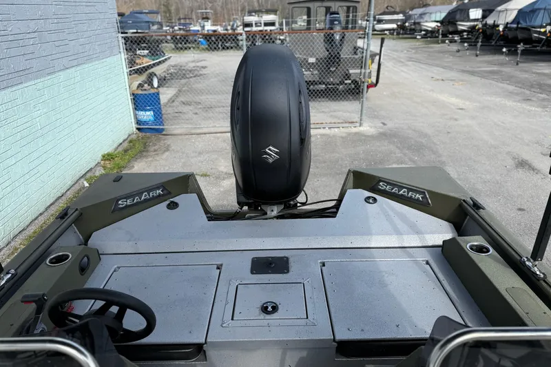 Slide: The Image of 2026 SeaArk Easy 200 boat with Suzuki outboard motor, parked in a marina. - 9