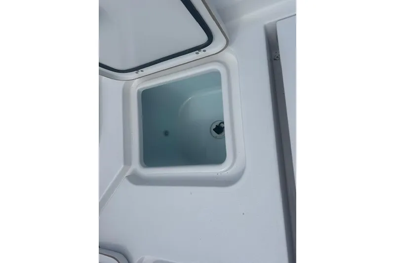 Slide: The Image of Open storage compartment on 2017 Sportsman Masters 267 Bay Boat. - 14