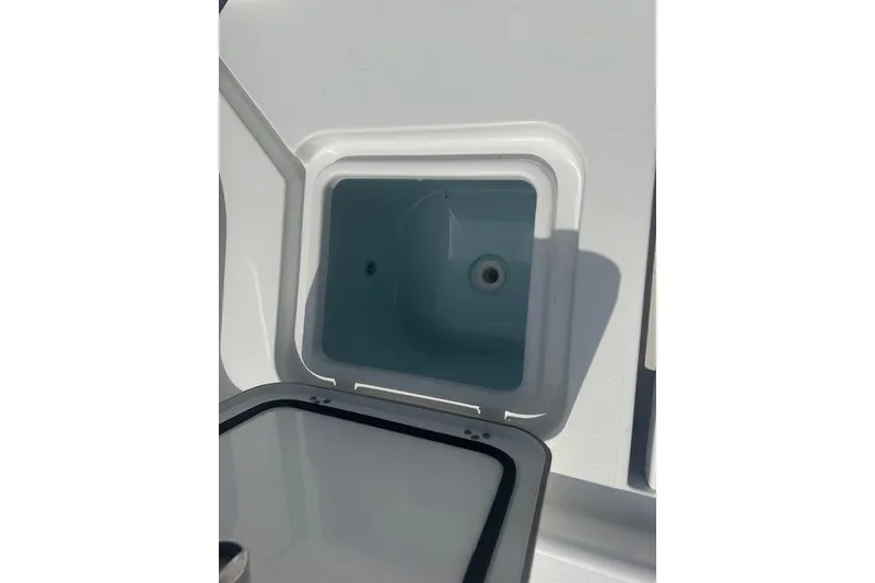 Slide: The Image of Open storage compartment on 2017 Sportsman Masters 267 Bay Boat. - 17