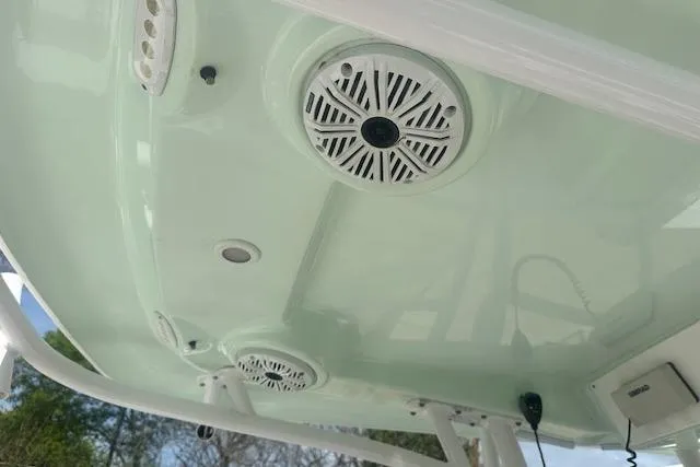 Slide: The Image of 2017 Sportsman Masters 267 Bay Boat with speakers and electronics on the underside of the canopy. - 18