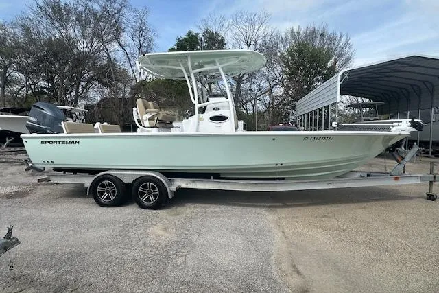 Slide: The Image of 2017 Sportsman Masters 267 Bay Boat on trailer, parked outdoors. - 2