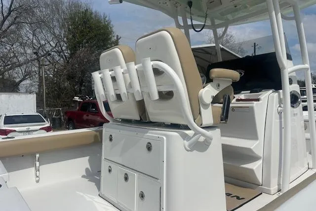 Slide: The Image of 2017 Sportsman Masters 267 Bay Boat interior with seating and storage compartments. - 22