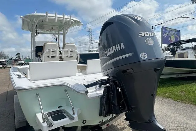 Slide: The Image of 2017 Sportsman Masters 267 Bay Boat with Yamaha 300 engine, parked outdoors. - 5