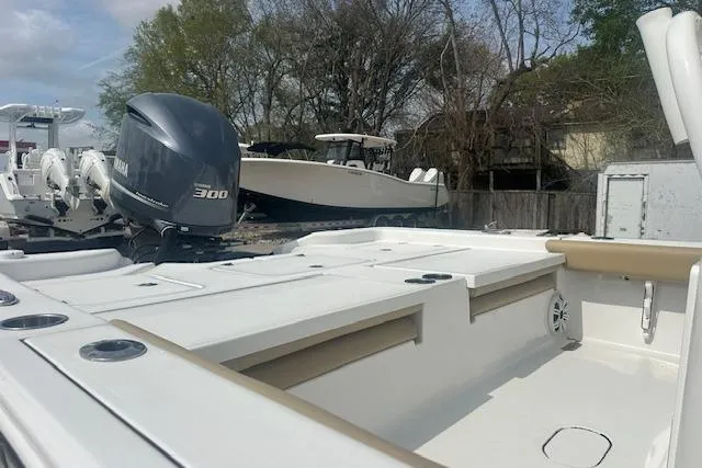 Slide: The Image of 2017 Sportsman Masters 267 Bay Boat with Yamaha 300 engine, parked outdoors. - 6