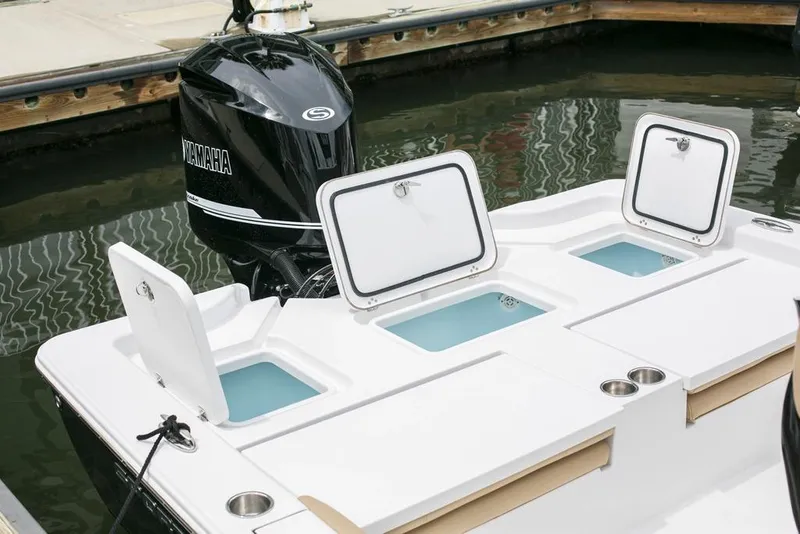 Slide: The Image of Manufacturer Provided Image: 2017 Sportsman Masters 267 Bay Boat with open storage compartments and Yamaha outboard motor. - 7