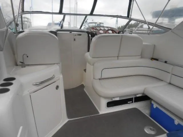 Slide: The Image of Interior of a 2005 Bayliner 305 yacht with seating area. - 2