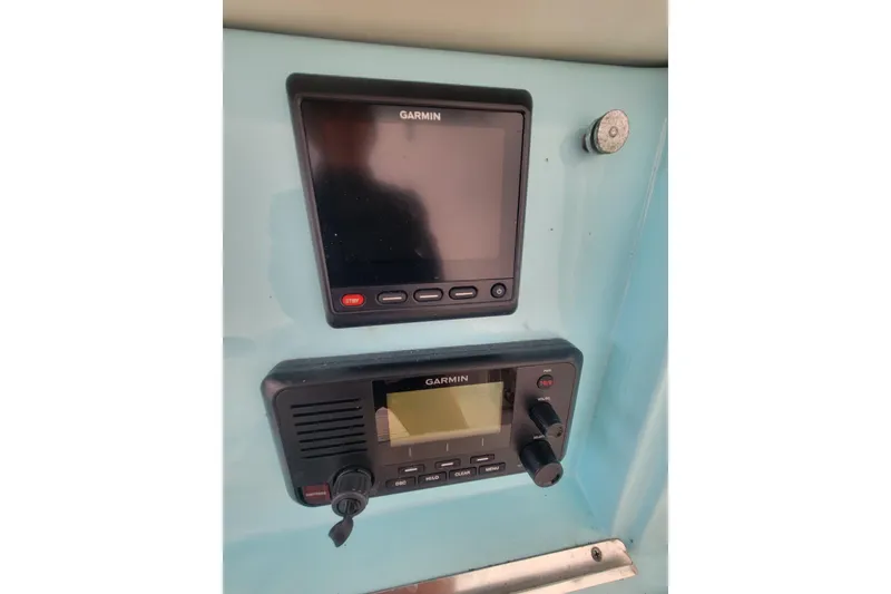 Slide: The Image of Garmin marine electronics on 2001 Shamrock 22 Open center console boat dashboard. - 11