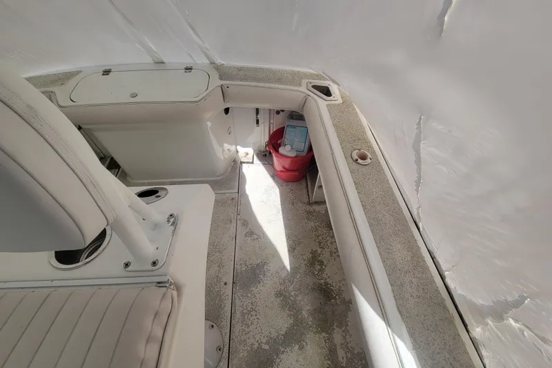 Slide: The Image of 2001 Shamrock 22 Open Center Console interior with seating and storage compartments. - 15