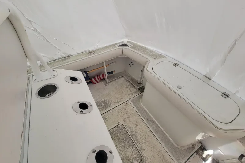 Slide: The Image of 2001 Shamrock 22 Open Center Console boat interior with storage compartments and cup holders. - 16