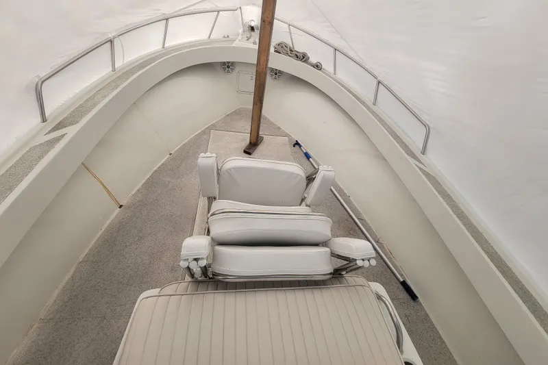 Slide: The Image of 2001 Shamrock 22 Open Center Console boat interior with white seating and railings. - 19