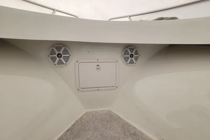Slide: The Image of 2001 Shamrock 22 Open Center Console boat interior with speakers and storage compartment. - 20