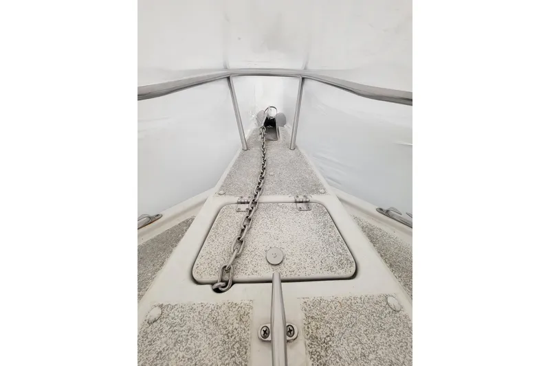 Slide: The Image of 2001 Shamrock 22 Open Center Console boat deck with anchor chain and hatch. - 22