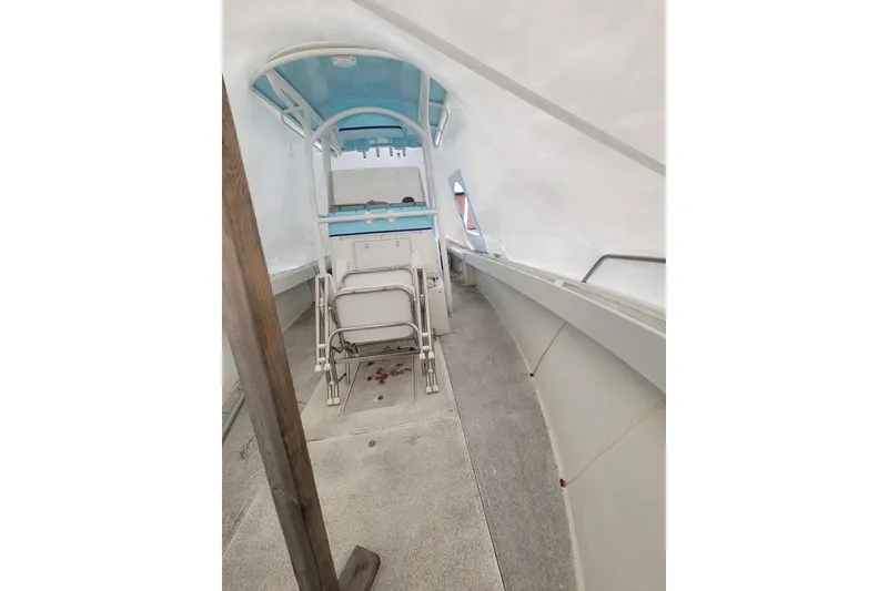 Slide: The Image of 2001 Shamrock 22 Open Center Console boat interior with seating and console view. - 23