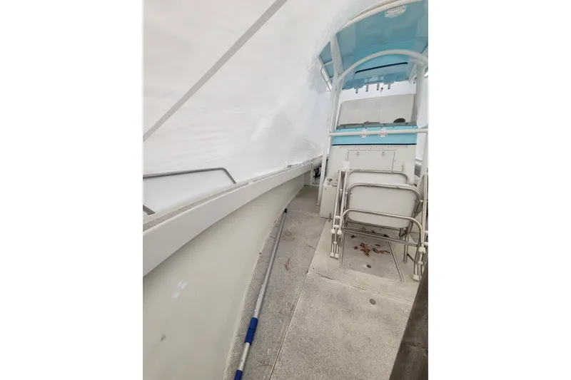 Slide: The Image of 2001 Shamrock 22 Open Center Console boat interior with seating and console view. - 24