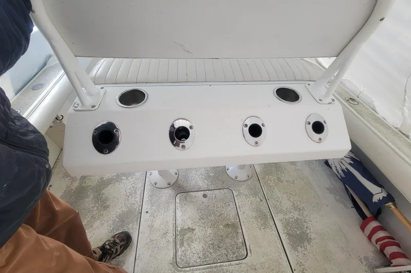 Slide: The Image of 2001 Shamrock 22 Open Center Console boat interior with rod holders and seating. - 26