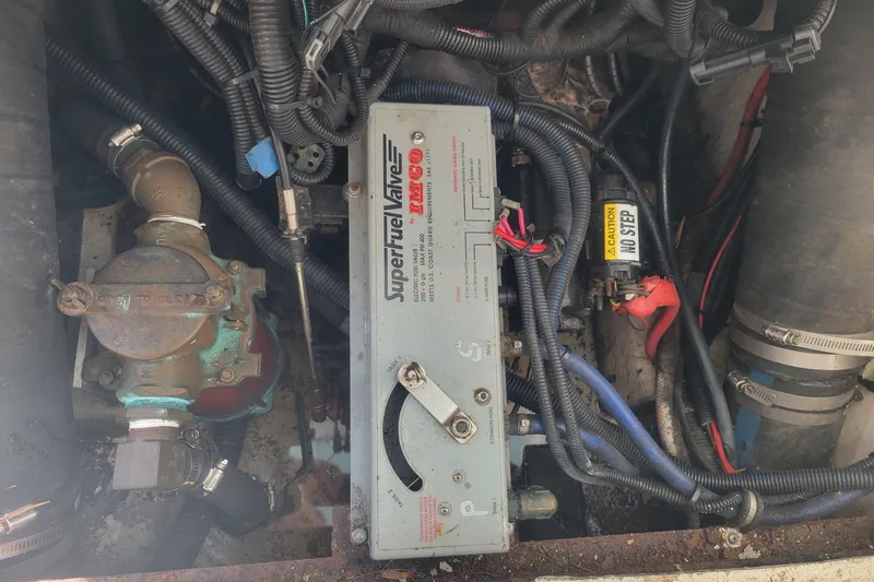 Slide: The Image of Engine compartment of a 2001 Shamrock 220 Open boat, featuring wiring and components. - 34