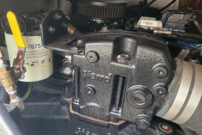 Slide: The Image of Close-up of a 2001 Shamrock 220 Open engine component with visible oil filter. - 36