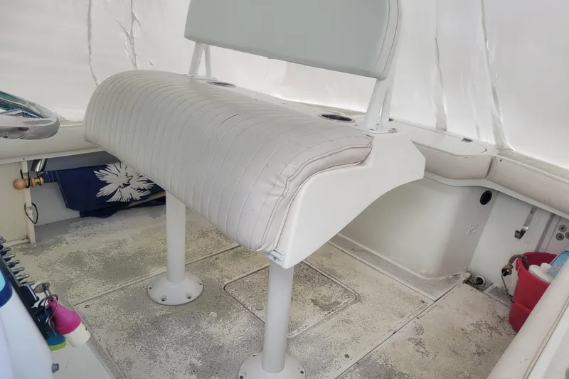 Slide: The Image of 2001 Shamrock 22 Open Center Console boat interior with white seating and storage. - 5