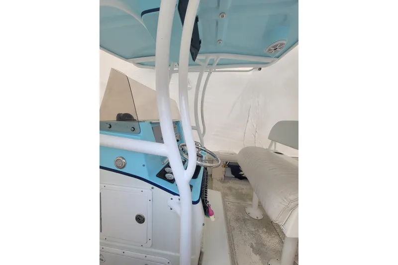 Slide: The Image of 2001 Shamrock 22 Open Center Console boat interior with steering wheel and seating. - 6