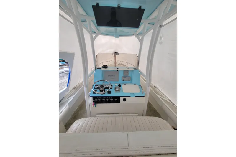 Slide: The Image of 2001 Shamrock 22 Open Center Console boat interior with steering wheel and controls. - 8