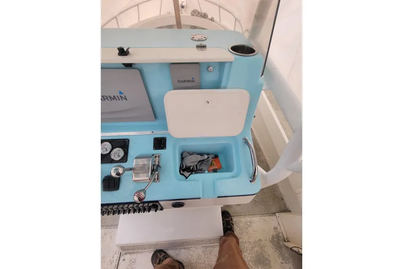 Slide: The Image of Center console of 2001 Shamrock 22 Open boat with Garmin equipment. - 9