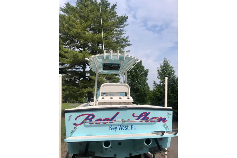Slide: The Image of 2001 Shamrock 22 Open Center Console boat, Key West, FL, with trees in the background. - 3