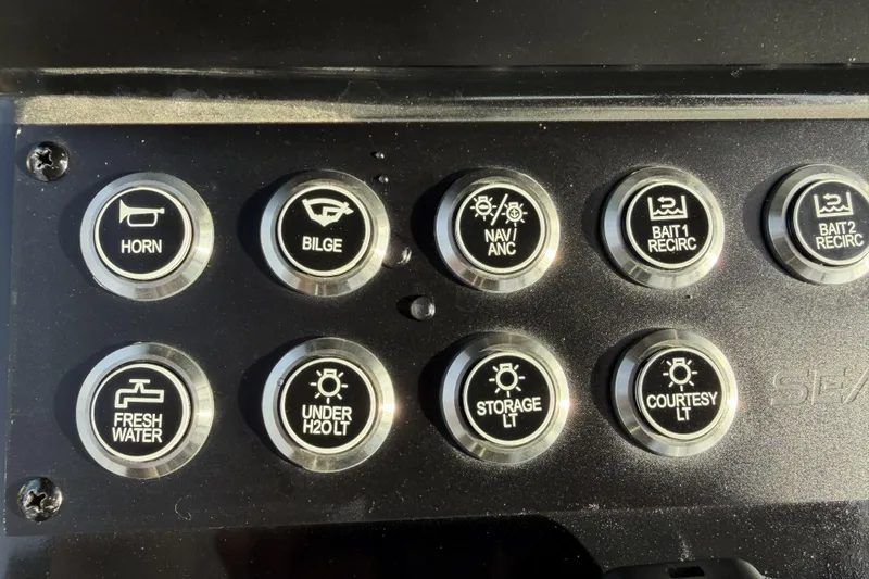 Slide: The Image of Control panel of 2024 Sea Born SX239 Offshore boat with labeled buttons. - 17