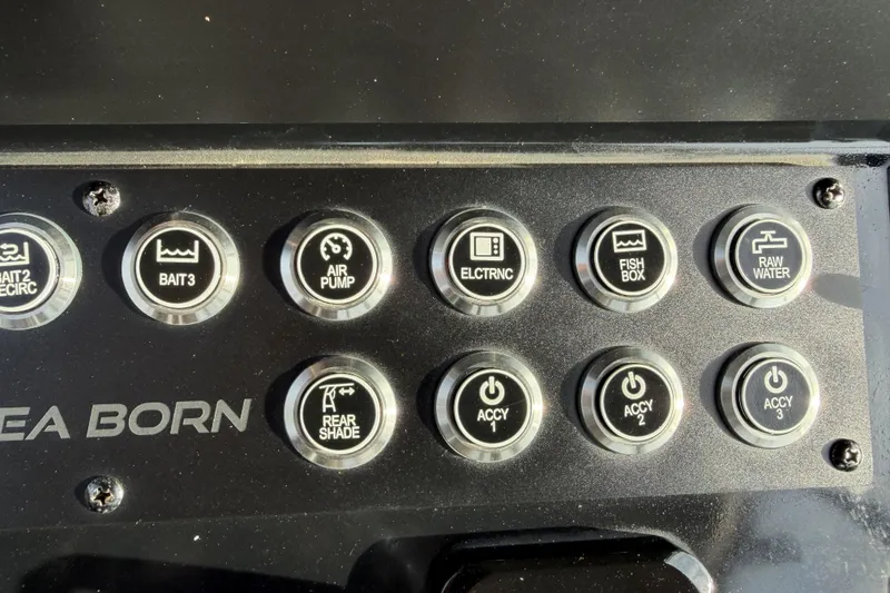 Slide: The Image of 2024 Sea Born SX239 Offshore control panel with various function buttons. - 18