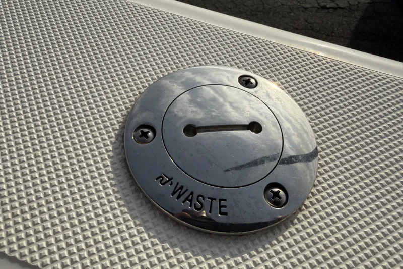 Slide: The Image of 2024 Sea Born SX239 Offshore waste cap on textured deck surface. - 20